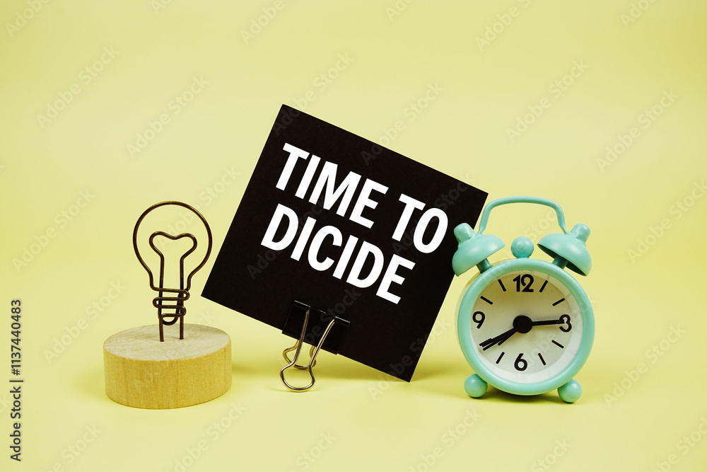 Poster time to dicide text message on paper card with alarm clcok on yellow background