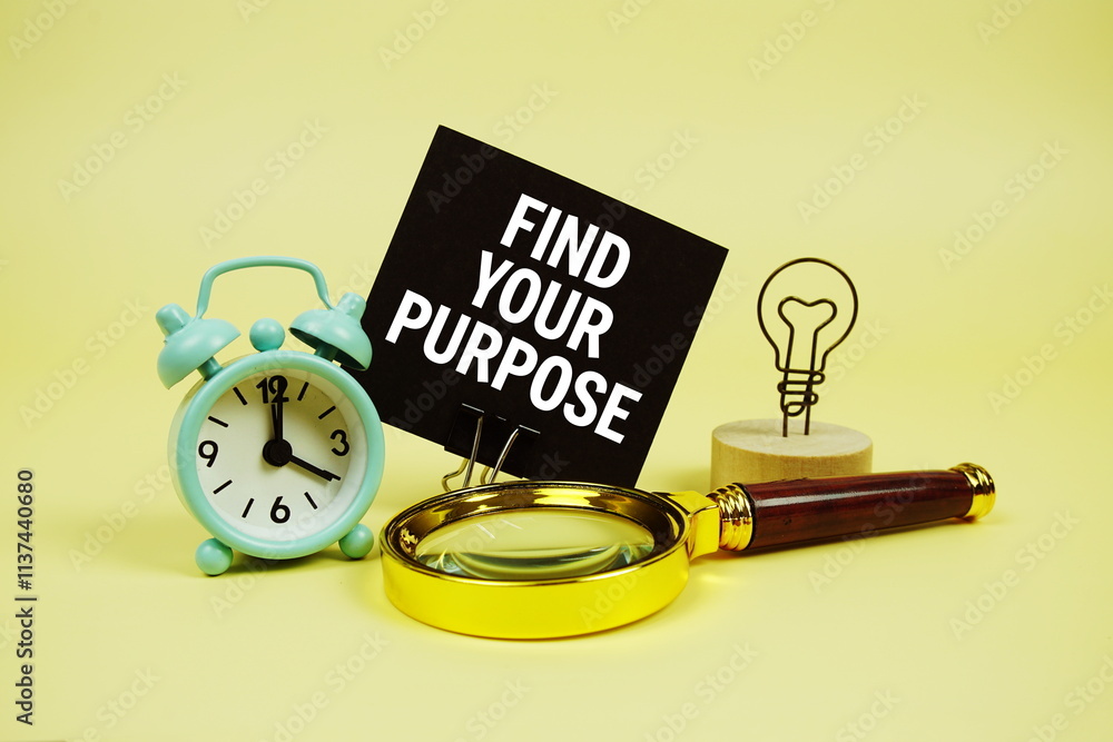 Poster find your purpose text message on sticky note with magnifying glass and alarm clock on yellow backgr