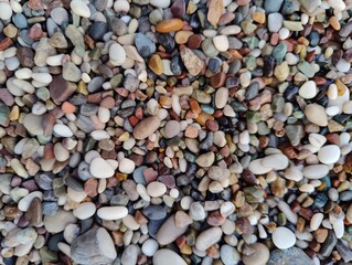 A Vibrant Collection of Pebbles: Diversity and Harmony in Nature's Smallest Forms, a Metaphor for Unity and Uniqueness.