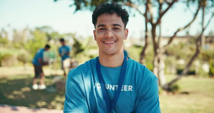 Outdoor, man and face with smile for volunteering, community service and distribution for charity. Happy, coordinator and portrait with pride for donation project, nonprofit and social responsibility