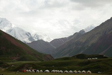 Yurt camp at Tulpar Kul Lake at the foot of Lenin Peak in the Pamir Mountains in Kyrgyzstan