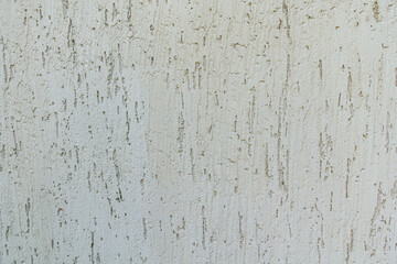 Detailed texture of bark plaster, showcasing its weathered surface and unique pattern. Ideal for architectural, 3d design, texturing surfaces, creative grunge effect. Grey decorative texture close up.