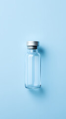 Transparent glass bottle on minimalist blue background