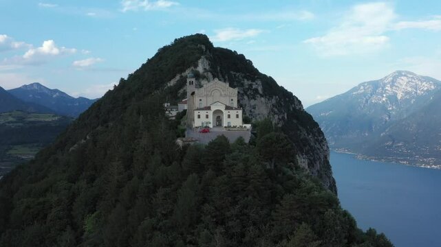 The famous church, Santuario di Montecastello, is located on a high mountain overlooking Lake Garda, Italy. A slow aerial flight from the church reveals a panoramic view of Lake Garda.