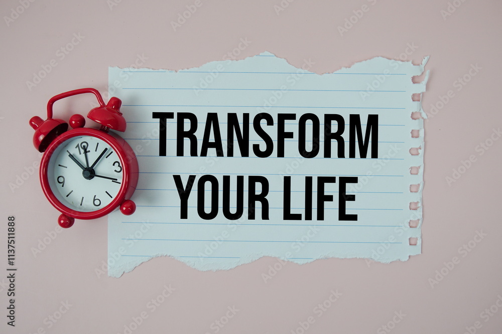 Poster transform your life text on paper torn with alarm clock top view on pink background