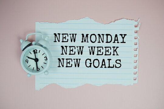 New Monday New Week New Goals text motivational and inspiration quote with alarm clock on pink background