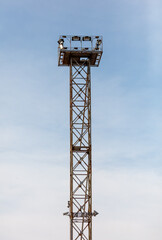 A tall metal structure with lights on top