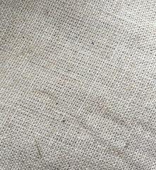 A white and tan fabric with a pattern of small squares