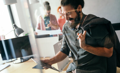 Leadership, tablet and hipster startup programmer CEO or manager in the office. Technology planning.