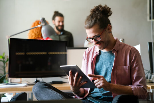 Success business man with tablet, analytics and developer for startup business website IT software