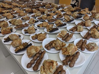 plate with food contain boiled quail eggs, fried tofu