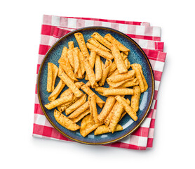 Rolled nachos tortilla chips on plate isolated on white background.