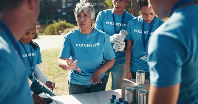 Volunteer, team and meeting with organizer in park for community service, collaboration and planning. NGO, charity and people with supplies in nature for food donation, support and welfare project