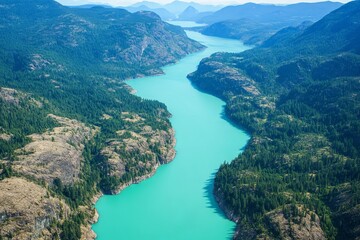 Obraz premium Aerial view of a turquoise river winding through rocky mountains in British Columbia. AI generated illustration