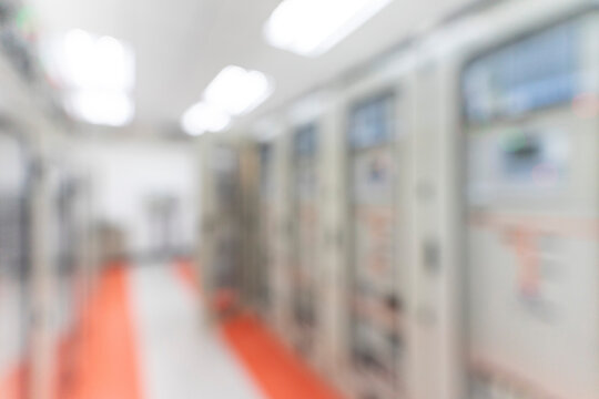 Blur image of electrical switchgear room of Industrial electrical power plant.