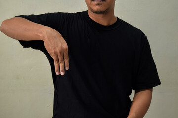 Young man making the letter M in brazilian sign language