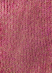 Wool fabric photographed close-up in a special design. Texture faded material. Clothing red background sweater