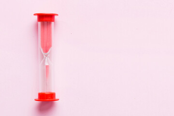 hourglass on the table, sand clock as time passing concept for business deadline, copy space