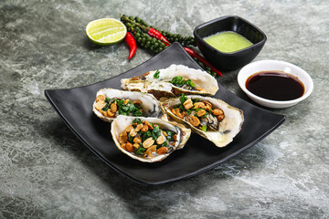 Open half oysters with green onion