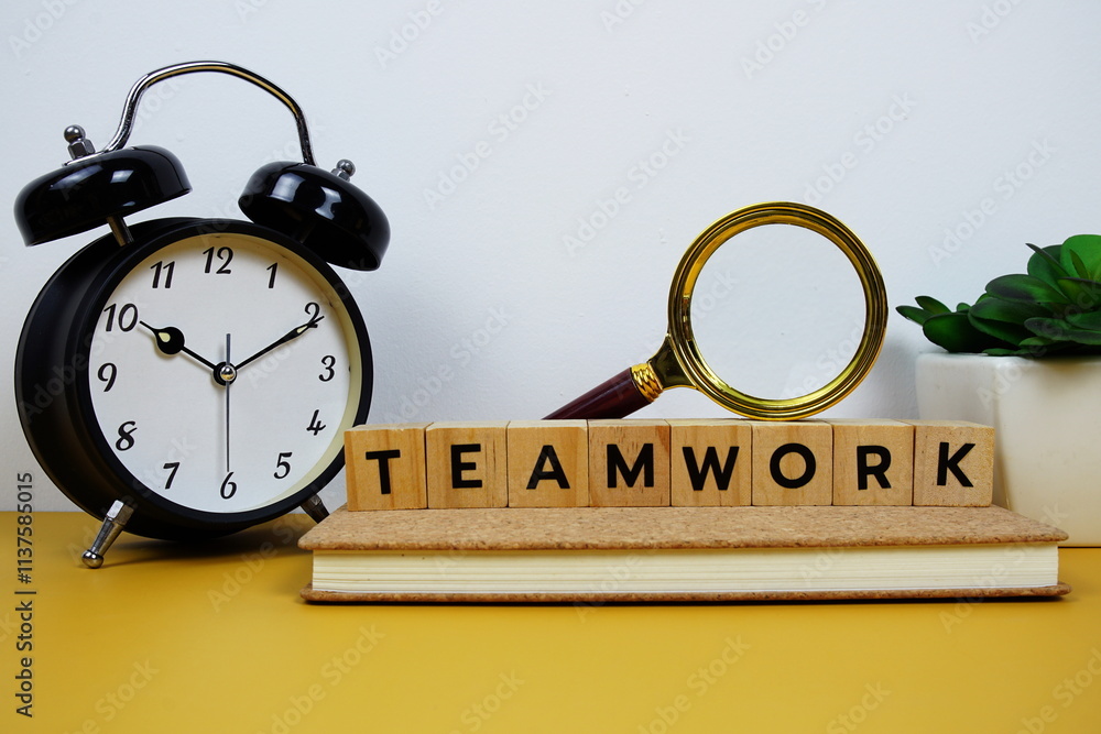Poster magnifying glass and alarm clock with wooden blocks alphabet letters teamwork text message on yellow