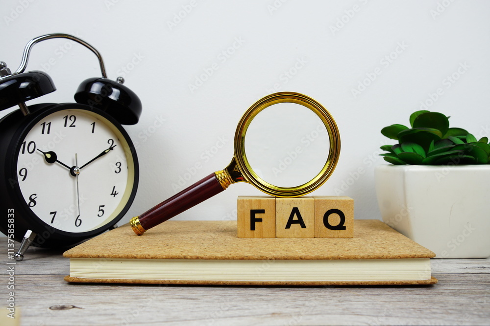Poster magnifying glass and alarm clock with wooden blocks alphabet letters faq text message on wooden back
