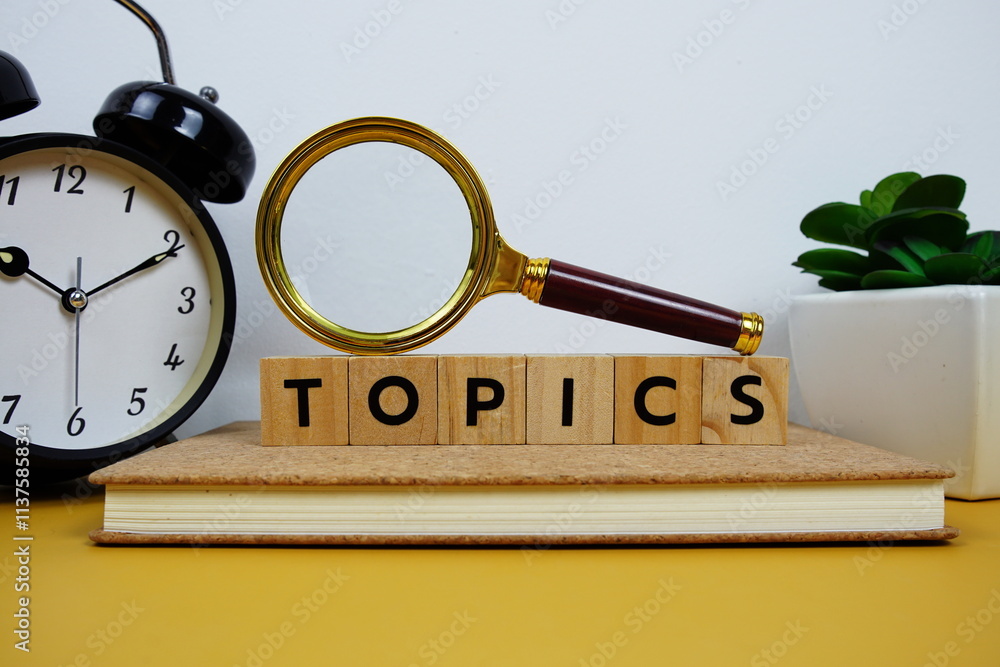 Aufkleber magnifying glass and alarm clock with wooden blocks alphabet letters topics text message on yellow b