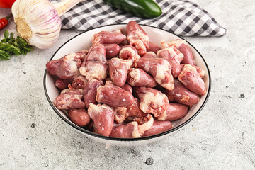 Fresh raw chicken hearts in the bowl