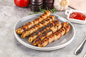 Grilled meat sausages wrapped bacon