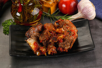 Baked beef ribs with vegetables