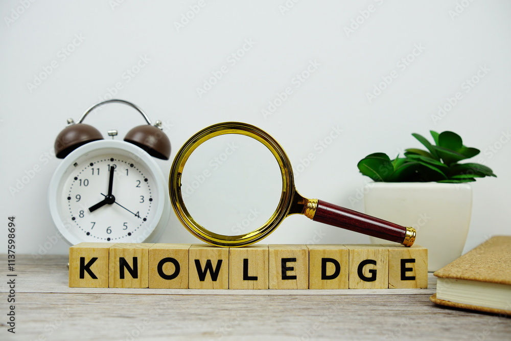 Aufkleber magnifying glass and alarm clock with wooden blocks alphabet letters knowledge text message on woode