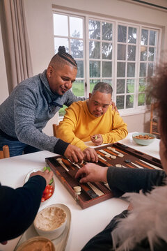 Friends playing backgammon