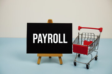 Payroll text message and trolley shopping cart on blue background