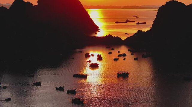 Majestic Ha Long Bay Sunset &ndash; Golden Reflections with Boats on Serene Waters, Perfect for Travel and Nature Projects