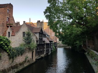 Fototapeta premium Old canal side buildings in Bruges, Belgium.