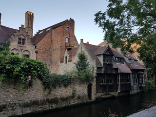 Fototapeta premium Old canal side buildings in Bruges, Belgium.