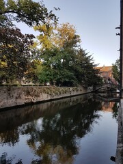 Fototapeta premium Boniface Bridge, canal and reflections on water in Bruges, Belgium.