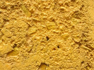 rough texture of yellow painted wall surface