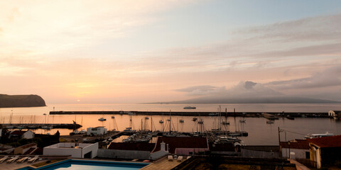 Sunrise at the marina of Horta, Faial Island, Azores. island of Pico in background.