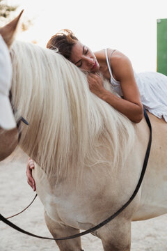 Woman relaxing on horseback