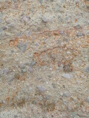 Photo of the exposed ground surface due to excavator dredging. The texture of the soil mixed with...