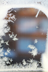 Close-Up of Frost Patterns on a Window in Winter