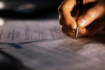 Hand Filling Out Form with Pen in Ambient Lighting - Document, Paperwork, Close-Up, Writing,...