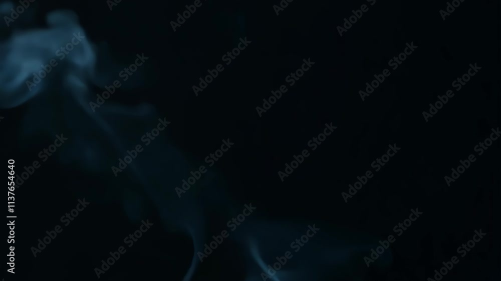Fototapete captivating blue smoke swirling gracefully in the dark background while creating mesmerizing pattern