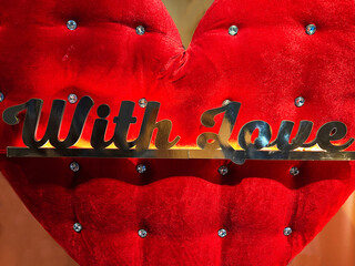 Heart with decorative text and rhinestones representing love and affection