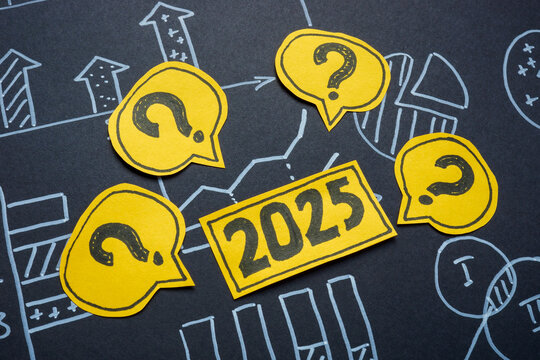 Financial charts, 2025 and question marks. Future market predictions and financial uncertainty.