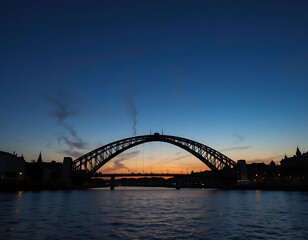 Naklejka premium Silhouette of an arched bridge over a river at twilight