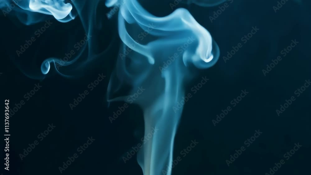 Aufkleber Wisps of blue smoke dancing against a dark background creating an ethereal atmosphere in a calm setting