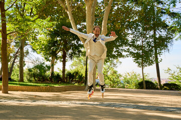 Man performing a jump on roller skates in a sunny park