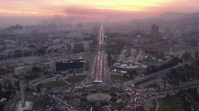 Aerial view of Damascus. Syrians celebrating the fall of Bashar al-Assad's regime. 