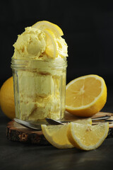 Lemon ice cream scoops in glass jar